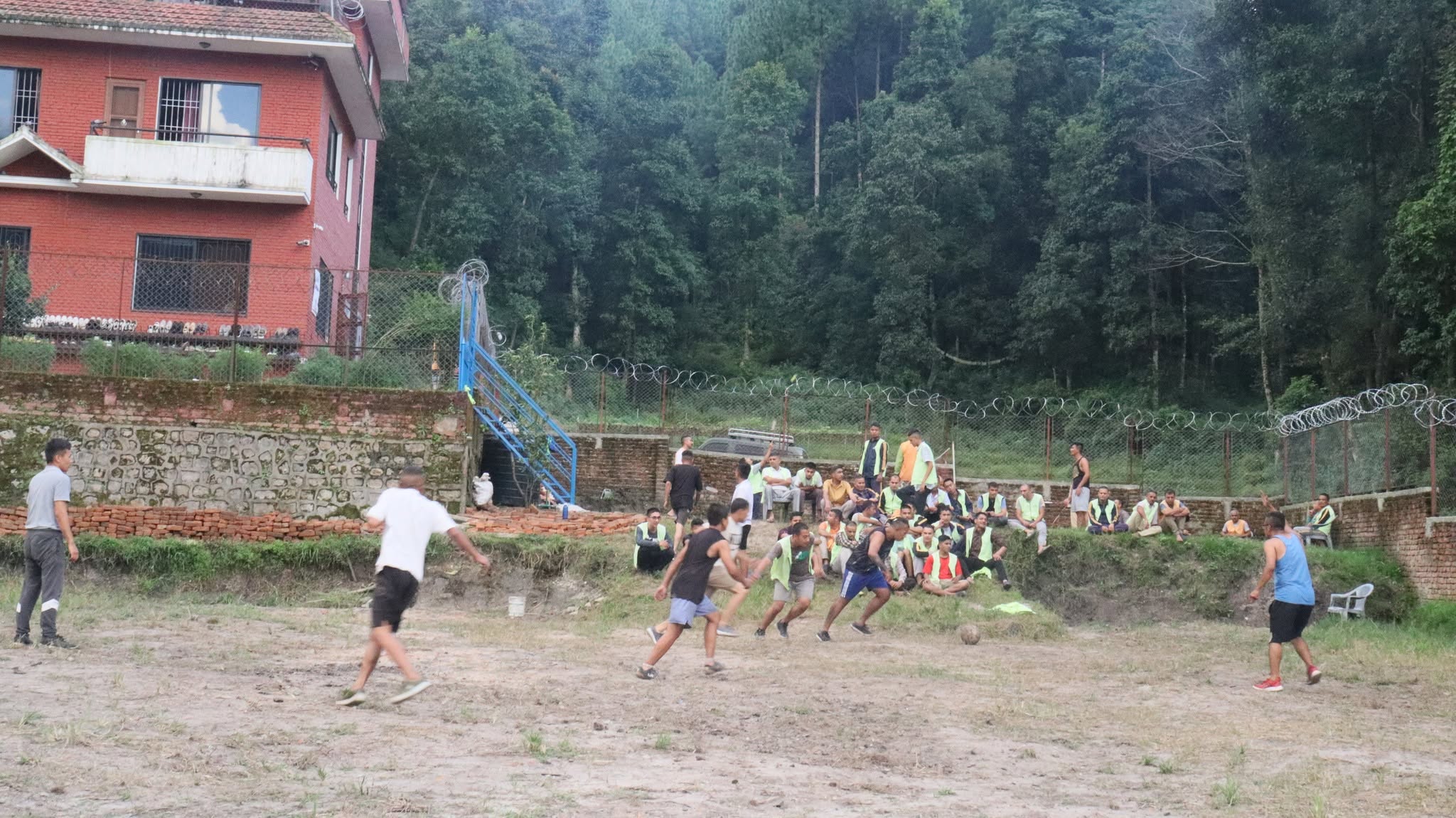 Residents playing football in the center ground