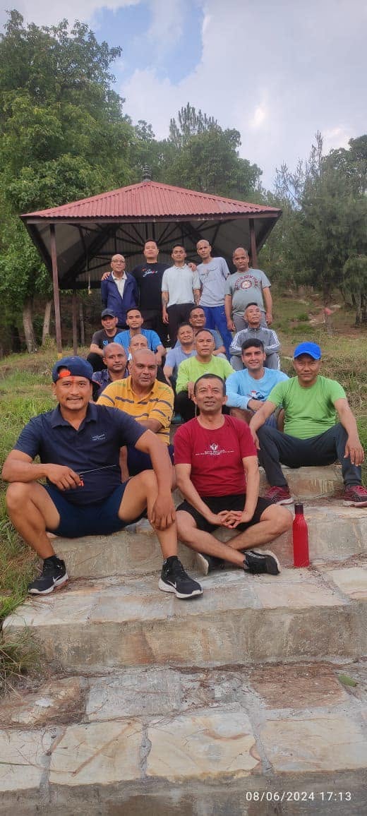 Residents sitting together near a gazebo in nature